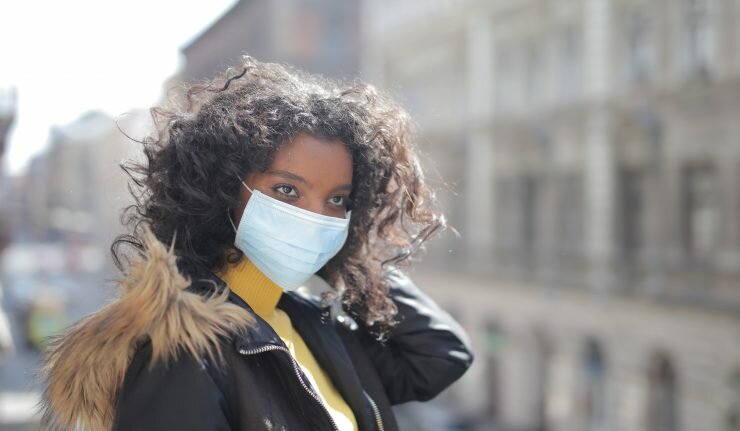 woman wearing black jacket and face mask